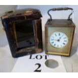 A miniature travelling carriage clock es