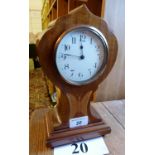 An Edwardian mahogany balloon clock with