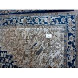 A Heriz rug (327 x 245 approx) est: £300