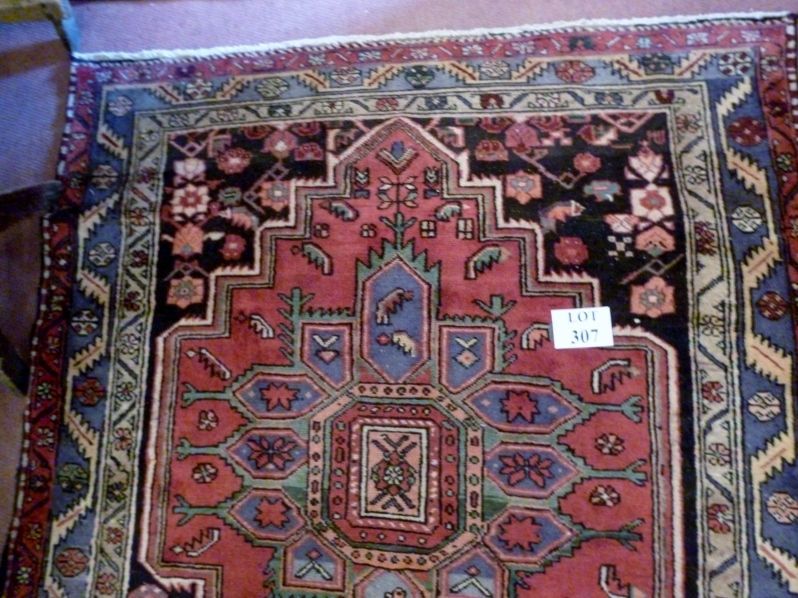 A Hamadan rug (300 x 145 approx) est: £1