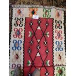 A hand knotted woolen rug on cream groun