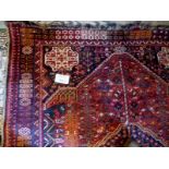 An early 20c Persian rug on red ground e