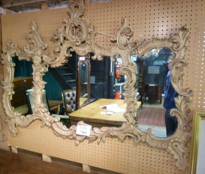 A 19c carved continental wall mirror wit