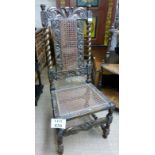 A 19c oak carved chair with cane seat an