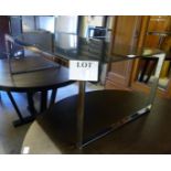 A designed chrome coffee table with blac