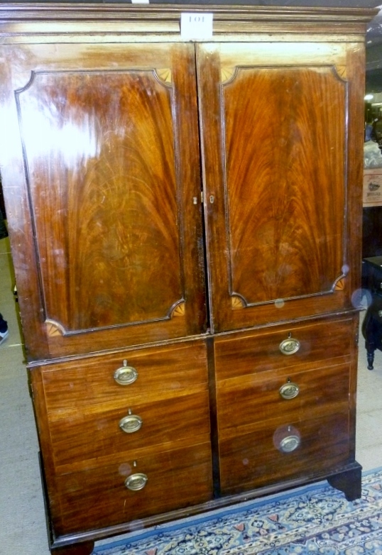 A Georgian mahogany double wardrobe with