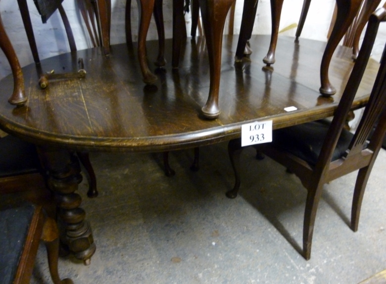 A c1900 oak wind out dining table with o