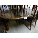 A c1900 oak wind out dining table with o