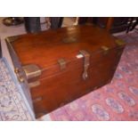 A teak and brass bound trunk in good con