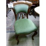 A set of four Victorian dining chairs up