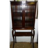 An Edwardian mahogany glazed bookcase/di