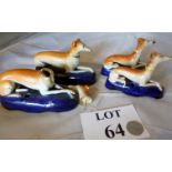 A pair of Staffordshire greyhound inkwel