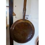 A copper warming pan est: £25-£45 (C)