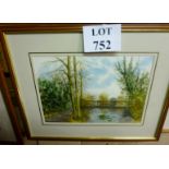 A framed and glazed watercolour country landscape scene with bridge over a river signed T W