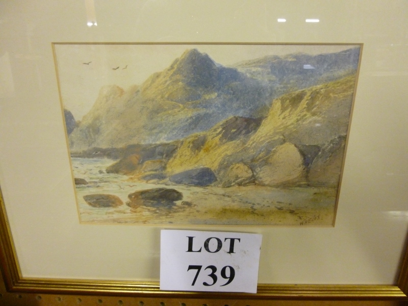 A framed and glazed watercolour depicting a coastal landscape scene signed by William Henry Earp