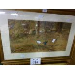 A framed and glazed watercolour country woodland scene with figure collection firewood,