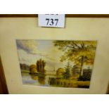 A framed and glazed watercolour study of a grand building from across a lake signed S Jabbot &