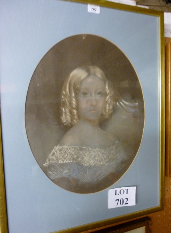 A framed and glazed oval portrait drawing of a lady (slightly a/f) est: £30-£50