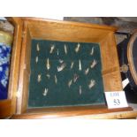 A collection of fishing flies in an oak and glazed case est: £40-£60 (AB10)