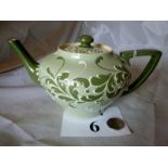 A James Moorcroft Macintyre Gesso Faience teapot and cover with tube-lined flowers and foliage est: