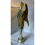 An unusual caved and gilt driftwood sculpture of an angel on brass base est: £50-£80 (K1)