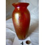 An iridescent red studio glass vase,