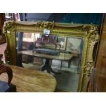 A very large 19c gilt carved wall mirror with heavy carving est: £450-£550