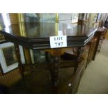 An Edwardian walnut octagonal centre table with fret work stretcher est: £50-£80