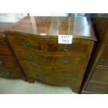 An Oak lined walnut serpentine chest of 2 over 3 drawers and terminating on bracket feet C1900 est: