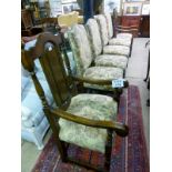 A set of six oak framed dining chairs to include two carvers est: £200-£300
