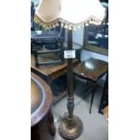 A carved standard lamp with shade est: £25-£40