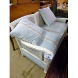 A late Victorian painted white Bergere two seater sofa with powder blue seats and cushions est: