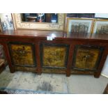 A large 19c Chinese lacquered sideboard with three painted sets of double doors and six small