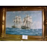 A gilt framed Montague Dawson print of two battle ships at sea bears printed signature est: £40-£60