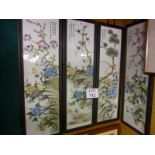 A set of four Chinese paintings on porcelain depicting scenes of birds amongst foliage all signed