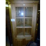 A late 20c pine corner display cupboard (6' 4" high approx) est: £40-£60