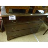 A George III mahogany short chest of three long drawers with swan handles and ogee bracket feet