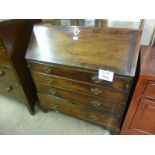 A Georgian mahogany writing bureau with a fitted interior over four long drawers est: £200-£400