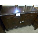 A 19c Colonial sideboard with carved panels to double doors and terminating on bun feet est:
