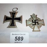 A German Iron Cross medal and a German Service medal est: £70-£90