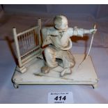 An oriental ivory carving of an kneeling archer signed (slightly a/f) est: £100-£130