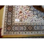 An Iranian hand knotted carpet on cream ground (204 x 260 cm approx) est: £150-£250