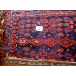 An early mid 20c Persian rug on blue field (220 x 130 cm approx) est: £70-£90