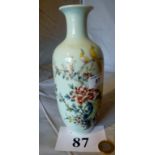 A Chinese narrow vase decorated with a pair of birds amongst blossom and a rocky garden,
