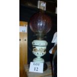 A painted glass oil lamp with etched cranberry glass shade est: £40-£60 (A1)