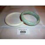 A white jade bangle and a light green jade bangle est: £40-£60