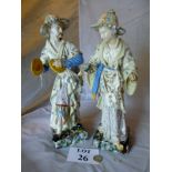 A large pair of continental Majolica figurines stamped 'W&R L' to base modelled as a Chinaman