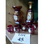 A Bohemian ruby glass liqueur set for six and a flower painted vase est: £15-£25 (B12)