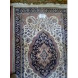 A fine 20c eastern rug on cream ground (160 x 93 cm approx) est: £40-£60