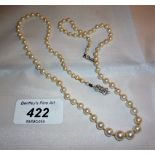 A strand of individually knotted graduated cultured pearls with a 9ct white gold and diamond clasp